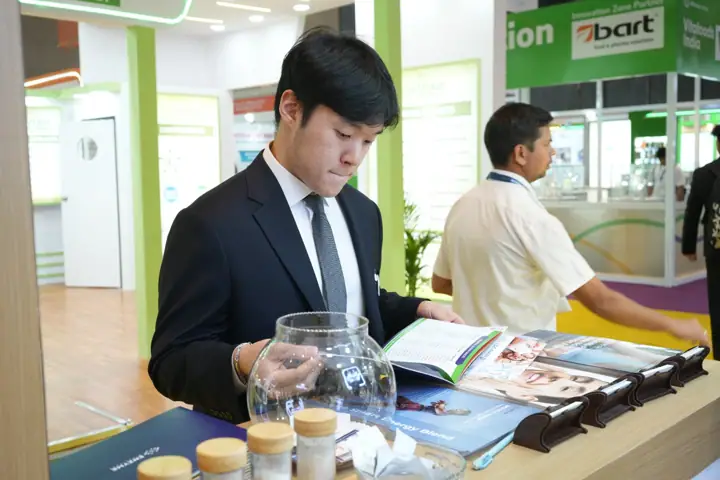 Visitor checking product samples at our stand