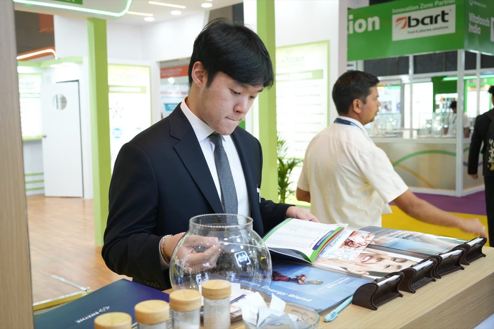 Visitor reading the product brochure